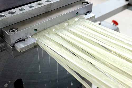 What are the classifications of glass fibers for FRP and their advantages and disadvantages