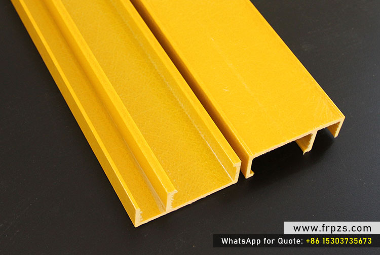 Close-up of two yellow FRP custom grooved and specialized structural profiles, ideal for industrial flooring or decking applications.